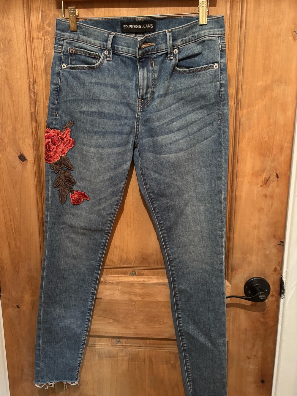 Express blue jeans with embroidered flowers